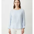Calder Blouse in Sky Blue, model shot on white