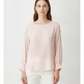 Calder Blouse in Soft Pink, model shot on white