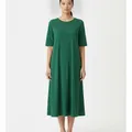 Tarn Midi Dress in Emerald, model shot on white