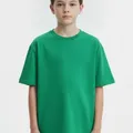 Quarry Kids Graphic Tee in Green, model shot on white