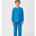 Wycliffe Kids Pyjama Set in Blue, model shot on white