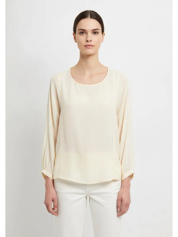Hadley Blouse in Ivory, model shot on white