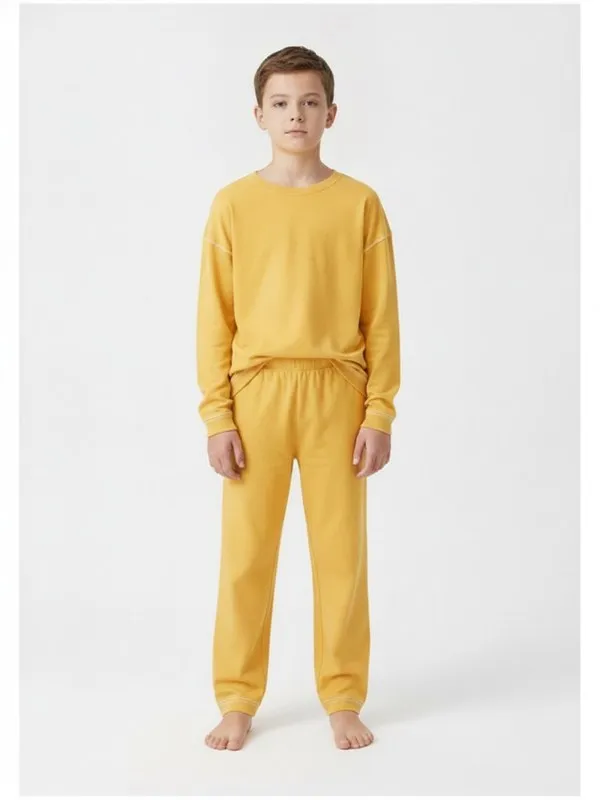 Aster Kids Pyjama Set in Yellow, model shot on white