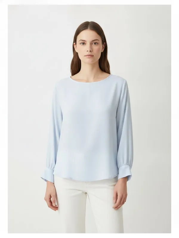 Calder Blouse in Sky Blue, model shot on white