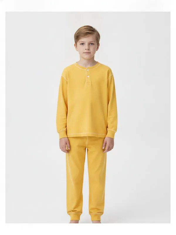Wycliffe Kids Pyjama Set in Yellow, model shot on white