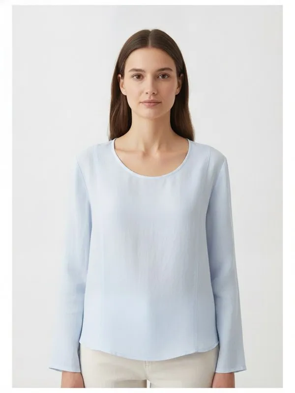Ellis Blouse in Sky Blue, model shot on white