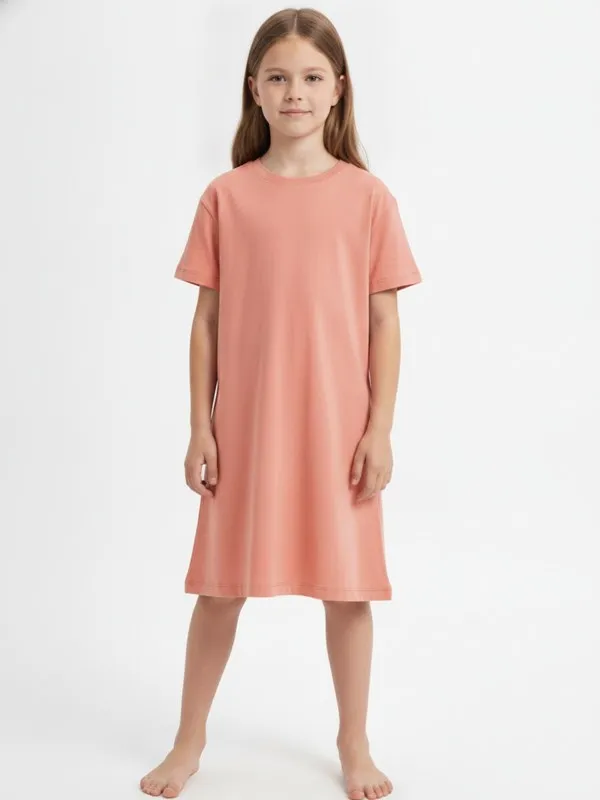 Bramley Kids Day Dress in Coral, model shot on white
