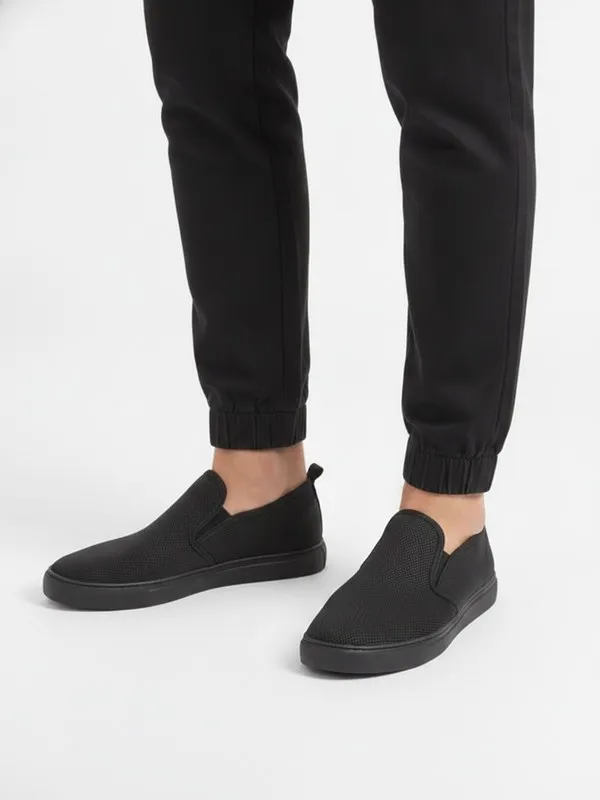Bramley Everyday Trainer in Black, model shot on white