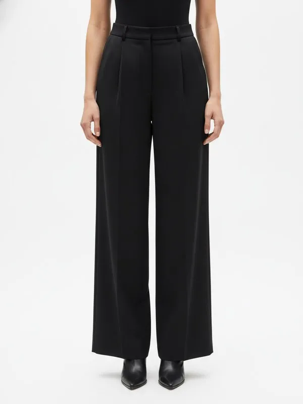 Langford Wide Leg Trouser in Black, model shot on white