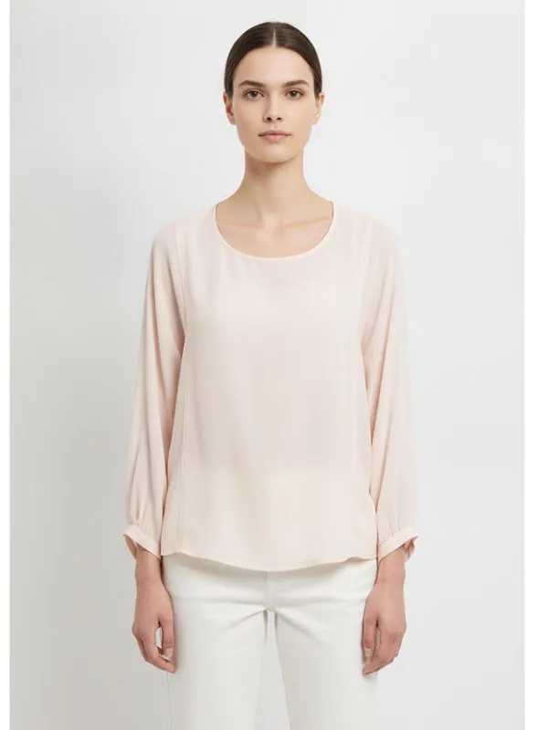 Hadley Blouse in Soft Pink, model shot on white
