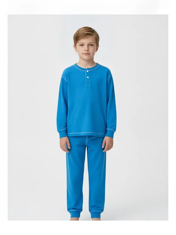 Wycliffe Kids Pyjama Set in Blue, model shot on white