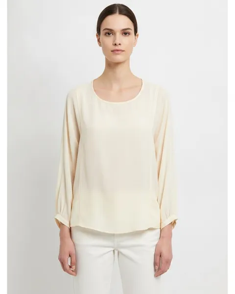 Hadley Blouse in Ivory, model shot on white